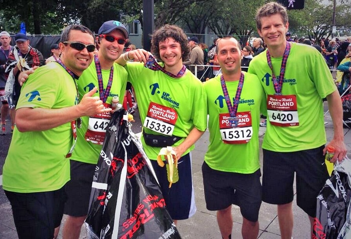 Hunter (second from right) celebrates with others from The Harbor after completing the Rock 'n' Roll Portland Half Marathon.